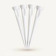 Four solid white HEP Tees Pro golf tees on a warm off-white background